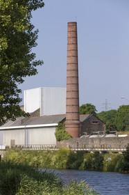 Red brick chimney of the former distillery_ Plancoët .