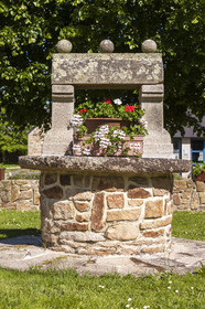 An old water well in front of the Town Hall of Brandérion